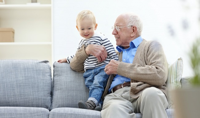 Homepage small ad with senior man and toddler sitting on a couch
